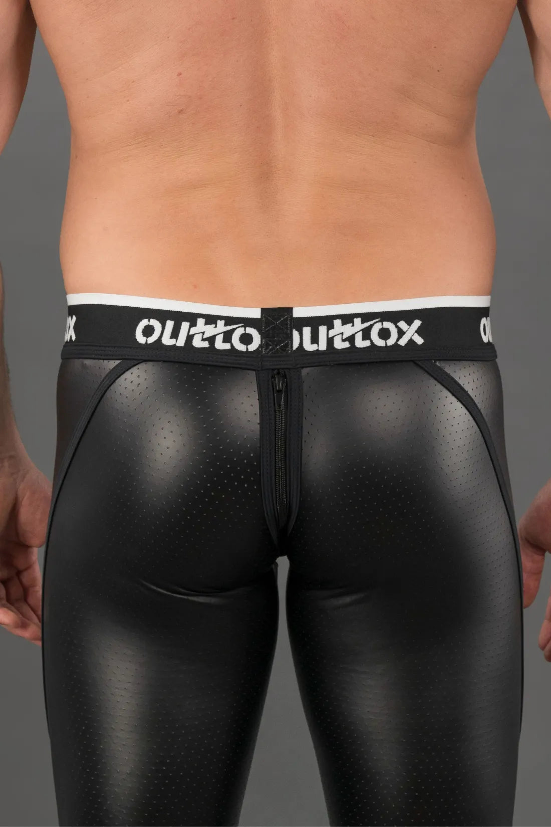 Outtox. Leggings mit Reißverschluss hinten und Snap-Codpiece. Schwarz