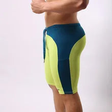 Maskulo NSH340 Spandex 2-Color Knee Shorts in Green Neon/Turquoise, U-shaped design, tight fit, ideal for gym, sports, or daily wear.