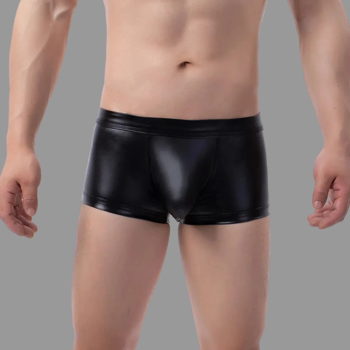 Maskulo NTR319 black PU leather mini shorts with open rear and bulge pouch, ideal for dating.
