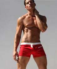 Maskulo NSH365 Red/White Trunk Shorts with Lace and Zipper Pocket. Beach design, stylish club look, made of Polyester/Spandex. Ideal for gym, party, sports, or daily wear.