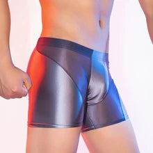 Maskulo NSH345 Silky Glossy Gray/Silver Mid-Thigh Shorts for men, semi-transparent polyester/spandex, ideal for gym, sports, or casual wear.