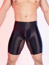 Maskulo NSH347 Silky Glossy Knee Shorts in Black/See-Through. Tight, stretchy polyester/spandex leggings, ideal for gym, sports, and casual wear.