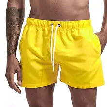 Maskulo NSH333 Yellow Free-to-body Nylon Shorts for men, with 2 pockets, white waist lace, soft inner lining, ideal for gym, sports, and casual wear.