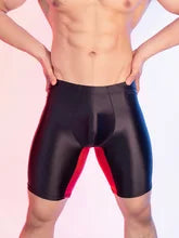Maskulo NSH348 Silky Glossy Knee Shorts in Black/Red See-Through. Tight, stretchy polyester/spandex leggings, ideal for gym, sports, and casual wear.