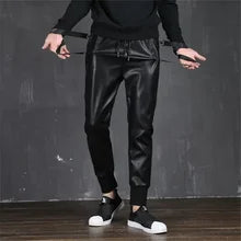 Black faux leather slim fit pants from Maskulo Berlin, designed for a sleek and stylish look.