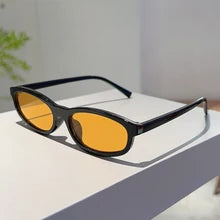 Maskulo NQ1380 Oval Sunglasses with black frame and yellow glass, made of PVC/Acryl. Ideal for daily wear, sports, and travel.